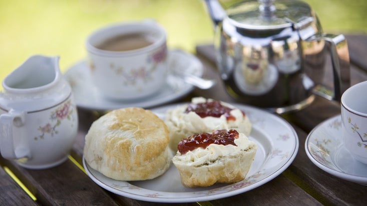 A close up of traditional cream tea outside the tea-room at Corfe Castle, Dorset